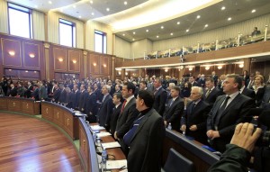 Members of parliament take the oath during its first session in Pristina